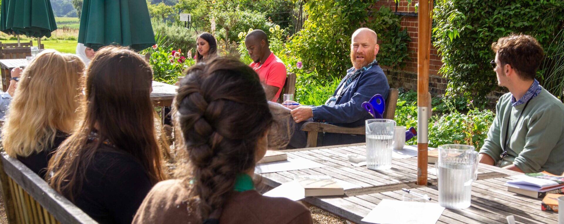 A group discussion activity on Cumberland Lodge grounds.