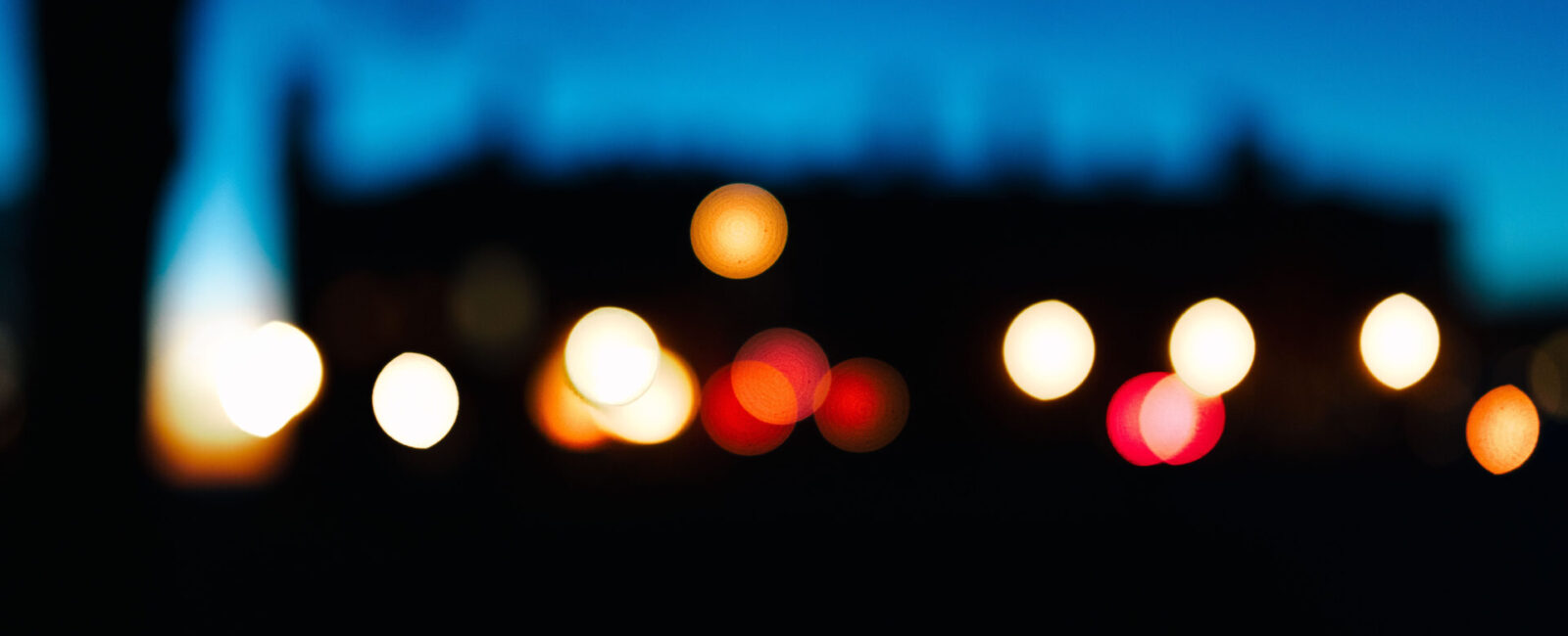 Cumberland Lodge, out of focus and silhouetted against the sunset sky.