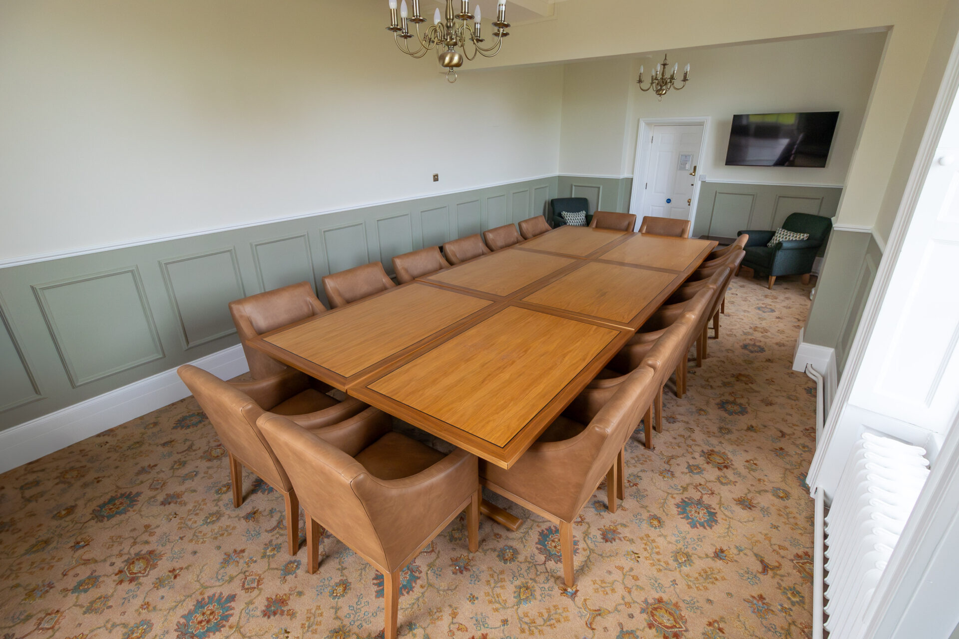 The Anderson meeting room in Cumberland Lodge, set up for 16 people in a board room layout