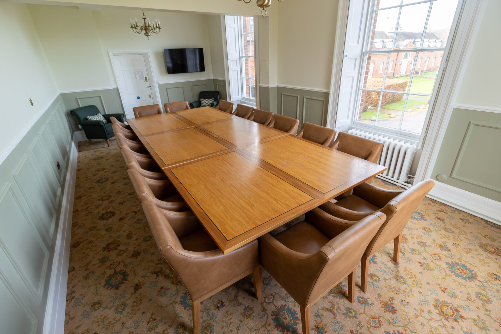 The Anderson meeting room in Cumberland Lodge, set up for 16 people in a board room layout