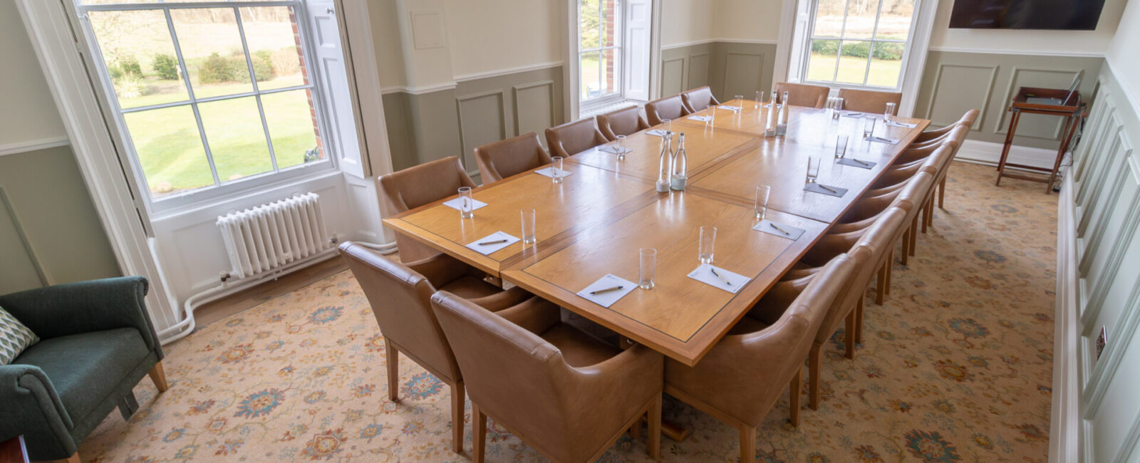 The Anderson meeting room in Cumberland Lodge, set up for 16 people in a board room layout