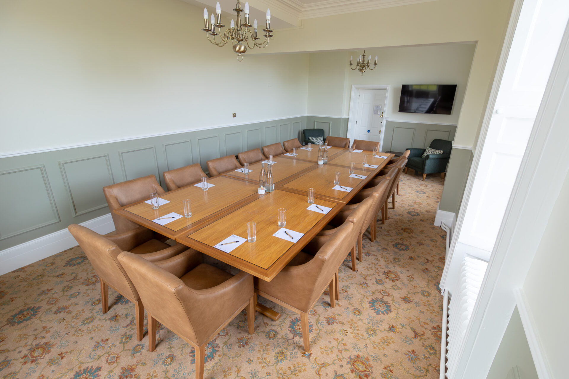 The Anderson meeting room in Cumberland Lodge, set up for 16 people in a board room layout