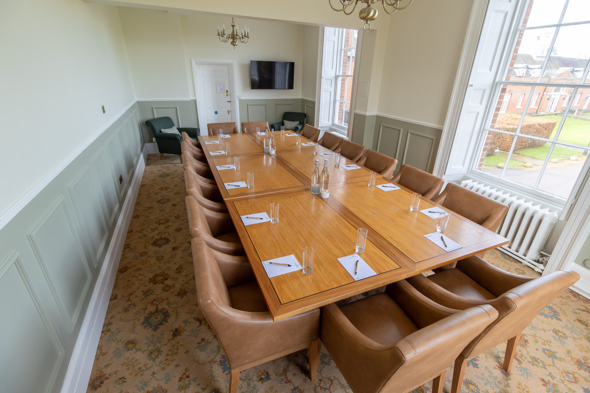 The Anderson meeting room in Cumberland Lodge, set up for 16 people in a board room layout