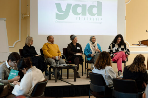 A panel of speakers on-stage at the Yad Fellowship Summit